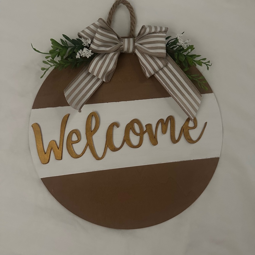 Brown and White Welcome Sign with Gold Lettering